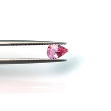Load image into Gallery viewer, Exuding the enchanting allure of a Padparadscha 0.66 carat - J N Gems
